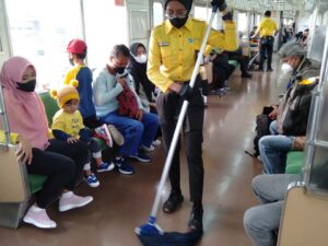 Cleaning Service Officers on Duty : Indonesia Commuter Train